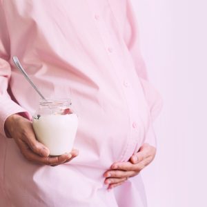 Nutrition during pregnancy. Pregnant woman with healthy food.